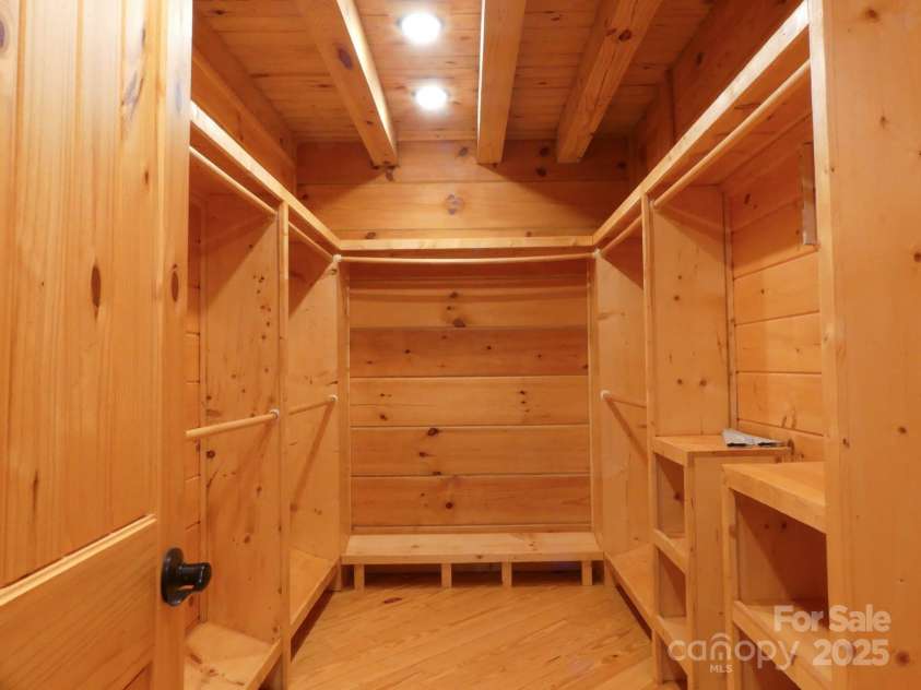 214 Whitney Boulevard, Lake Lure, NC 28746.  MLS# CAR4231828, YatesRealty ID 1404. Primary Closet