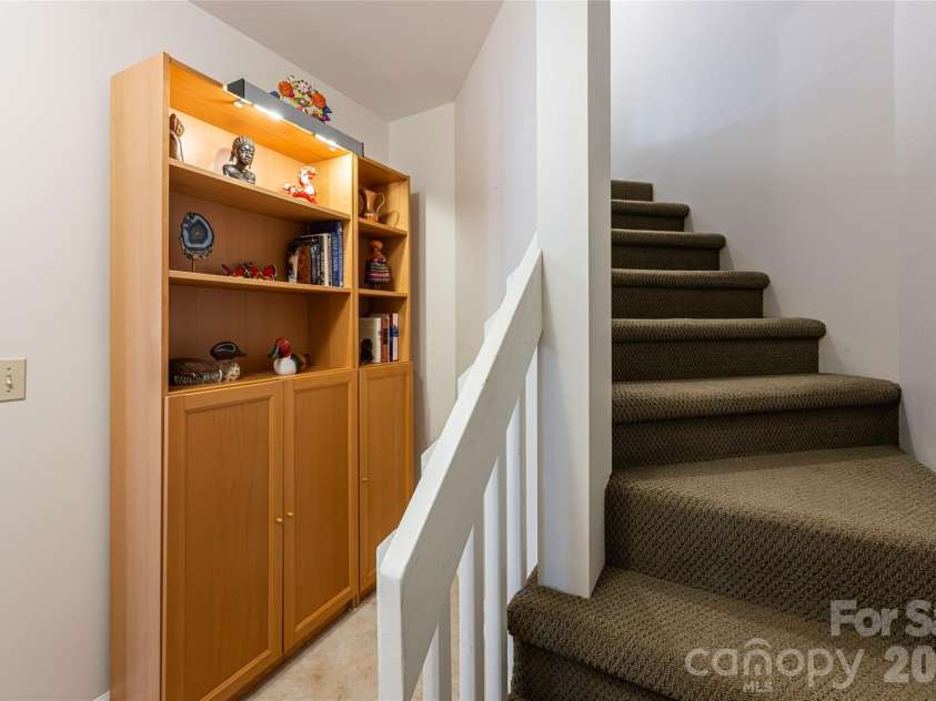 168 Skyview Circle, Asheville, NC 28804.  MLS# CAR4349077, YatesRealty ID 14041. Lower staircase