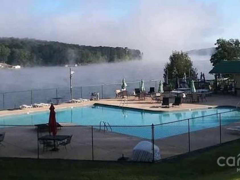 237 Roxboro Drive, Mount Gilead, NC 27306.  MLS# CAR4259785, YatesRealty ID 14047. Pool overlooking the lake