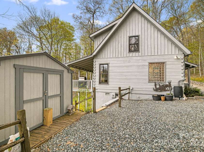 60 Laurel Lane, Mars Hill, NC 28754.  MLS# CAR4256396, YatesRealty ID 14054. Extra storage shed. Stairs lead down to the conditioned basement storage area.