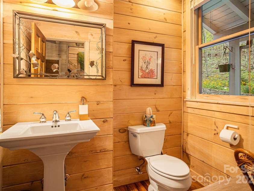 60 Laurel Lane, Mars Hill, NC 28754.  MLS# CAR4256396, YatesRealty ID 14054. Main level half bath