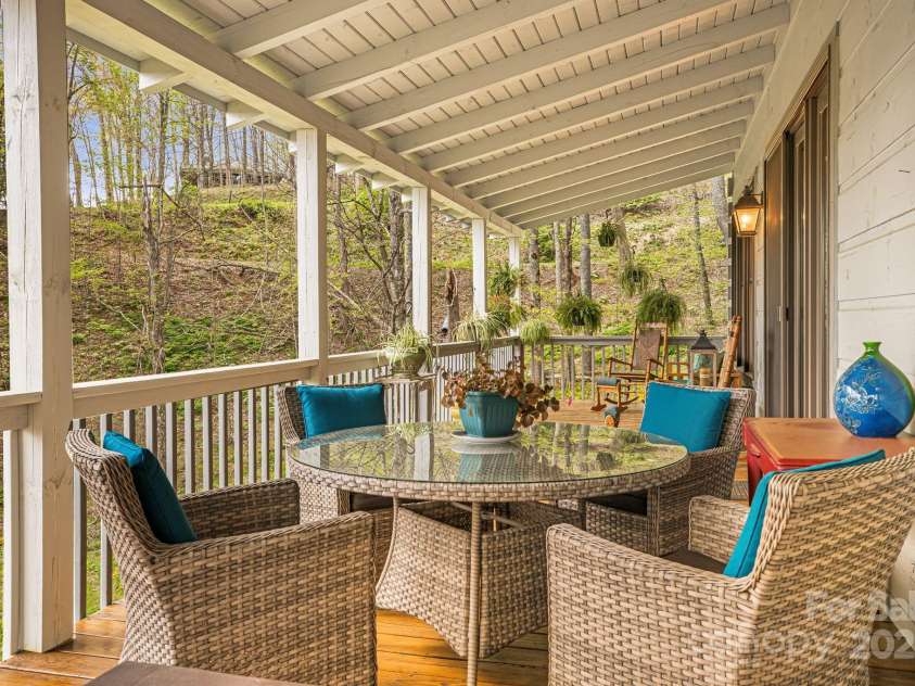 60 Laurel Lane, Mars Hill, NC 28754.  MLS# CAR4256396, YatesRealty ID 14054. Outdoor dining on the covered back deck.