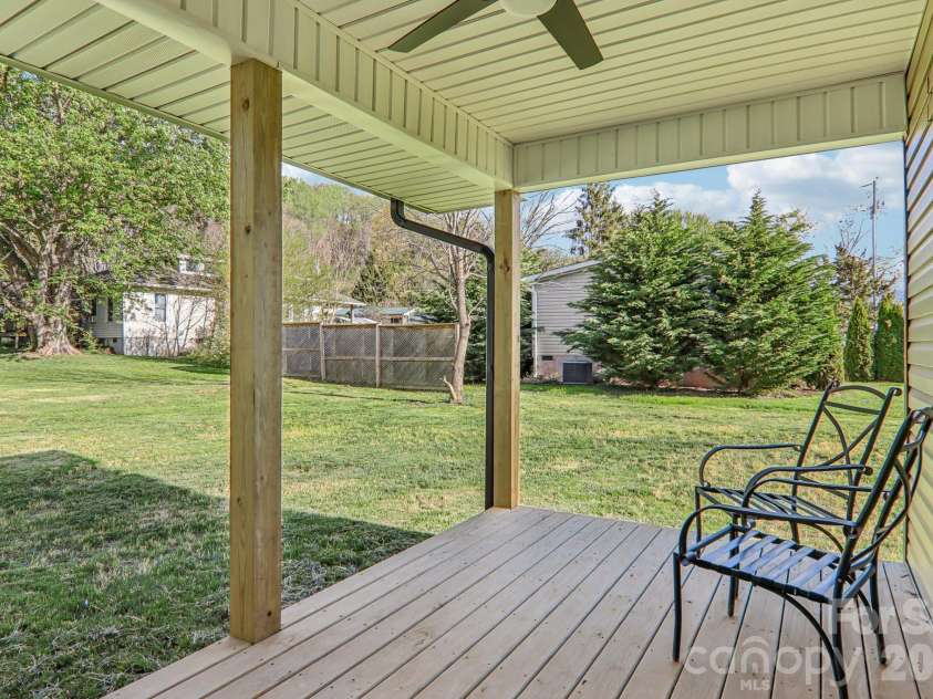 117 Virginia Avenue, Waynesville, NC 28786.  MLS# CAR4368956, YatesRealty ID 14059. Covered back deck