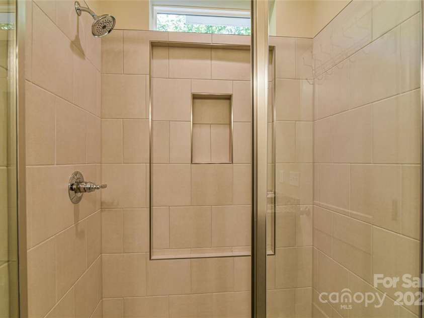 140 Atlantic Falls Trail, Black Mountain, NC 28711.  MLS# CAR4258087, YatesRealty ID 14059. Primary Shower on Main Level