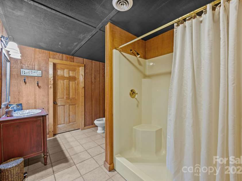 670 Barber Road, Zirconia, NC 28790.  MLS# CAR4293053, YatesRealty ID 1406. Basement bath off flex room currently bedroom