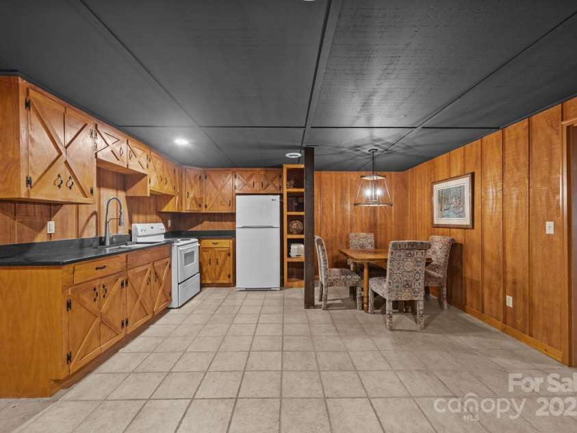 670 Barber Road, Zirconia, NC 28790.  MLS# CAR4293053, YatesRealty ID 1406. Basement kitchen