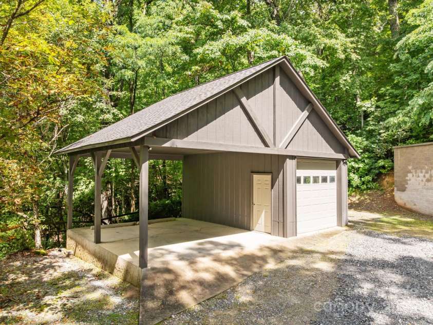 670 Barber Road, Zirconia, NC 28790.  MLS# CAR4293053, YatesRealty ID 1406. Garage and carport with ample additional parking