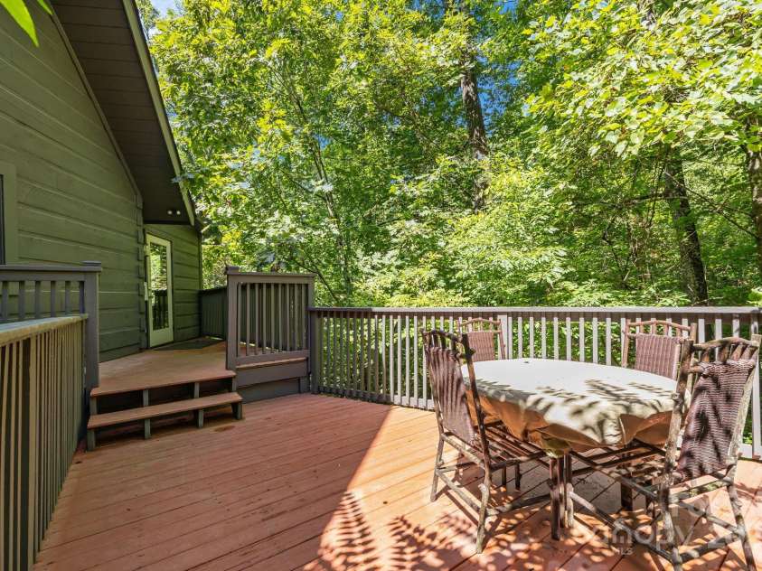 670 Barber Road, Zirconia, NC 28790.  MLS# CAR4293053, YatesRealty ID 1406. Private deck off primary bedroom sitting room