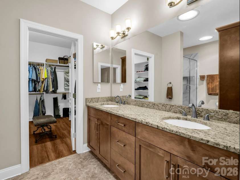 29 Stonehollow Lane, Brevard, NC 28712.  MLS# CAR4347760, YatesRealty ID 14076. Primary bath, dual sinks and granite, custom cabinitry