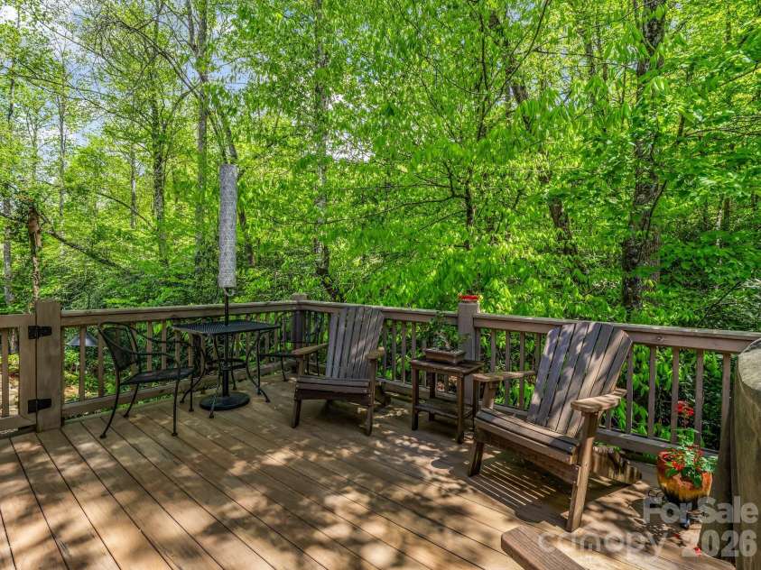 29 Stonehollow Lane, Brevard, NC 28712.  MLS# CAR4347760, YatesRealty ID 14076. Rear TimberTech deck with privacy and creek out back