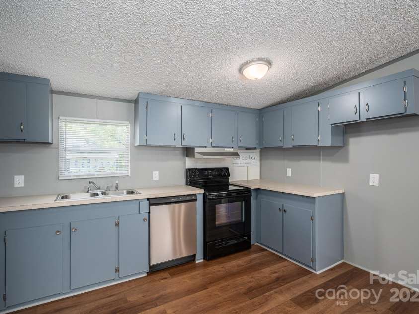 376 Puzzle Creek Road, Bostic, NC 28018.  MLS# CAR4260139, YatesRealty ID 14076. Doublewide kitchen