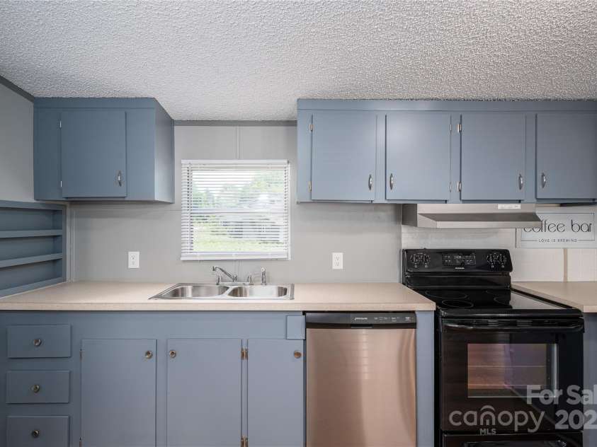 376 Puzzle Creek Road, Bostic, NC 28018.  MLS# CAR4260139, YatesRealty ID 14076. Doublewide kitchen