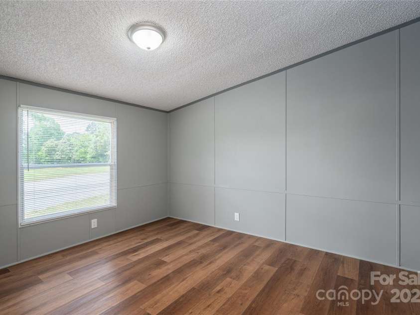 376 Puzzle Creek Road, Bostic, NC 28018.  MLS# CAR4260139, YatesRealty ID 14076. Doublewide primary bedroom