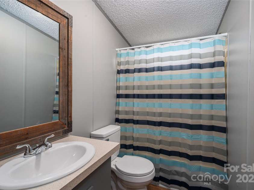 376 Puzzle Creek Road, Bostic, NC 28018.  MLS# CAR4260139, YatesRealty ID 14076. Doublewide secondary bath