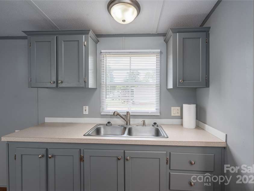 376 Puzzle Creek Road, Bostic, NC 28018.  MLS# CAR4260139, YatesRealty ID 14076. Single wide kitchen