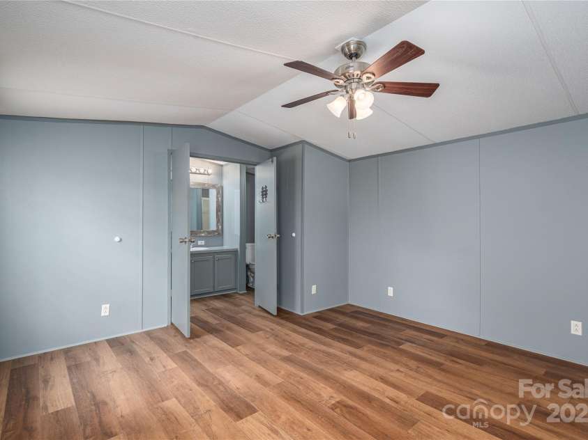 376 Puzzle Creek Road, Bostic, NC 28018.  MLS# CAR4260139, YatesRealty ID 14076. Single wide primary bedroom w/en suite