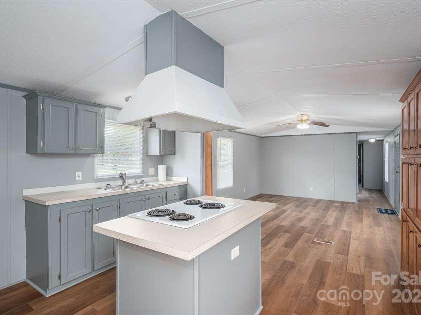 376 Puzzle Creek Road, Bostic, NC 28018.  MLS# CAR4260139, YatesRealty ID 14076. Singlewide open floorplan living/kitchen and dining space