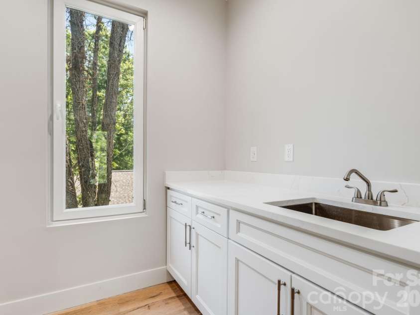211 Ruby Avenue, Black Mountain, NC 28711.  MLS# CAR4400341, YatesRealty ID 14084. Generous Laundry Room