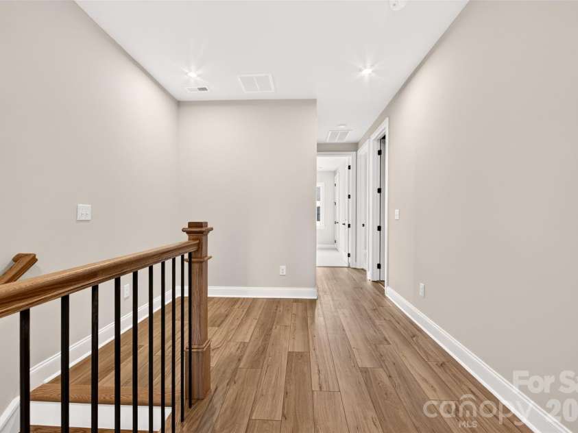 6012 Yellow Buckeye Drive, Charlotte, NC 28277.  MLS# CAR4396146, YatesRealty ID 14085. Third floor hallway with open rails