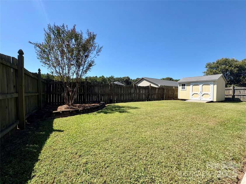 402 Church Street, Locust, NC 28097.  MLS# CAR4299636, YatesRealty ID 1409. 