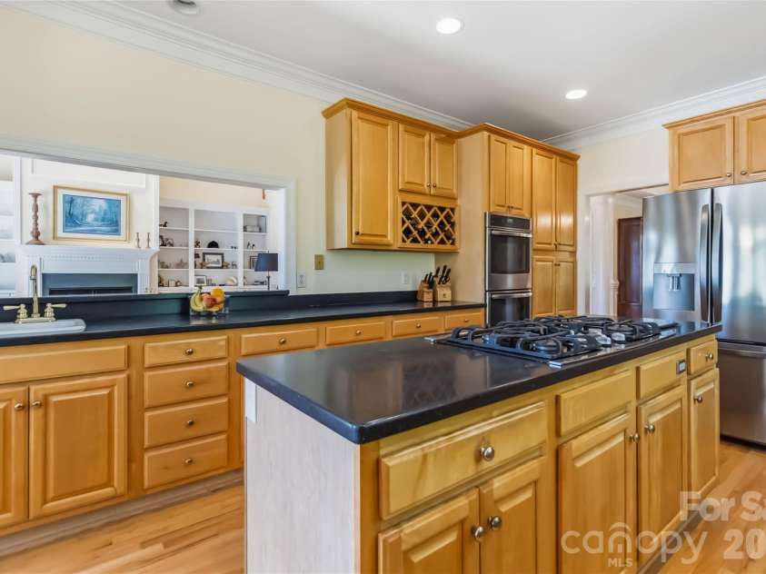 6208 Highview Road, Matthews, NC 28104.  MLS# CAR4363062, YatesRealty ID 14093. Kitchen open to the living area