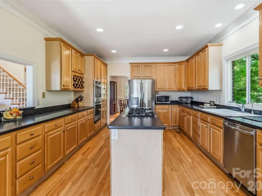 6208 Highview Road, Matthews, NC 28104.  MLS# CAR4363062, YatesRealty ID 14093. Massive kitchen with gas cooktop and double ovens!