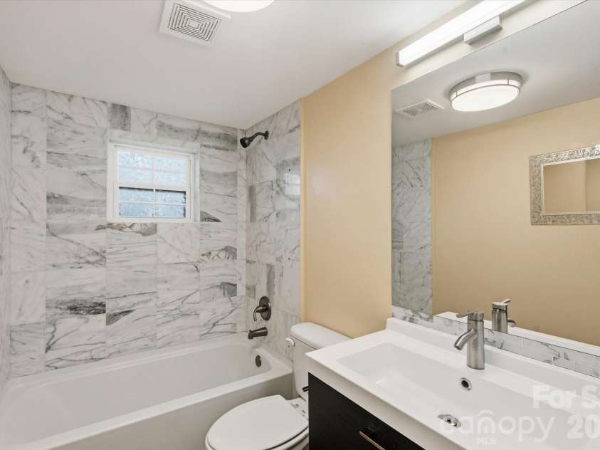 89 Carolina Avenue, Brevard, NC 28712.  MLS# CAR4366083, YatesRealty ID 14098. 