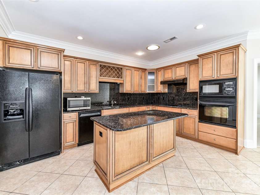 178 Harper Lee Street, Davidson, NC 28036.  MLS# CAR4232984, YatesRealty ID 14113. Island provides additional seating and storage