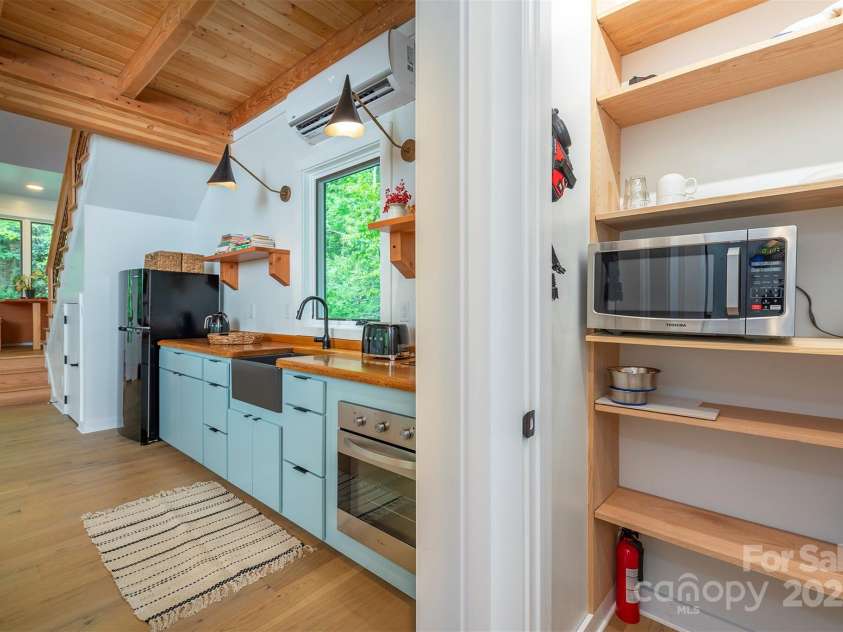 401 Winterle Road, Lake Lure, NC 28746.  MLS# CAR4254959, YatesRealty ID 14115. Convenient pantry next to the kitchen.