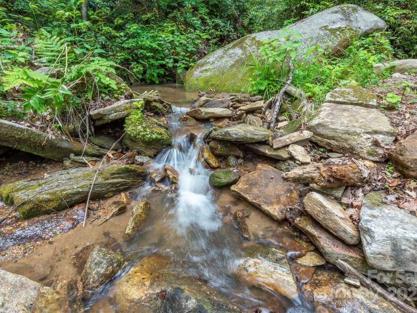 401 Winterle Road, Lake Lure, NC 28746.  MLS# CAR4254959, YatesRealty ID 14115. Mountain creeks bring calm and relaxation.