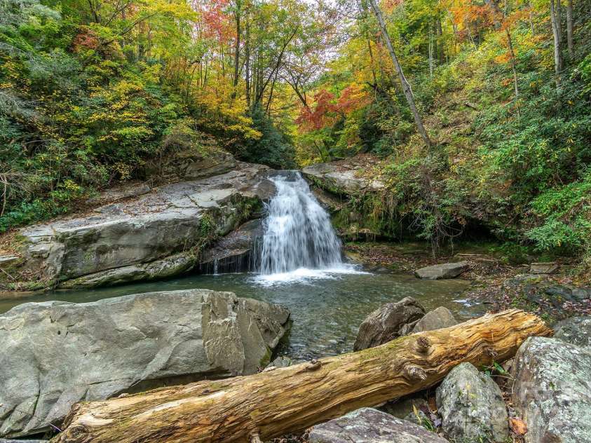 401 Winterle Road, Lake Lure, NC 28746.  MLS# CAR4254959, YatesRealty ID 14115. The main waterfall in the community is magnificent.