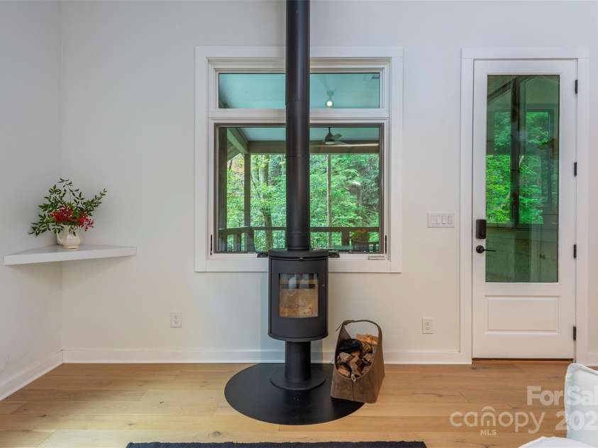 401 Winterle Road, Lake Lure, NC 28746.  MLS# CAR4254959, YatesRealty ID 14115. The perfect size fire for knocking out the chill in the evenings.