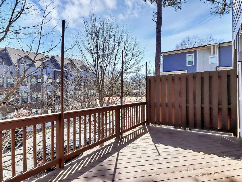 1037 Pierre Drive, Charlotte, NC 28205.  MLS# CAR4229357, YatesRealty ID 14116. Deck off the kitchen