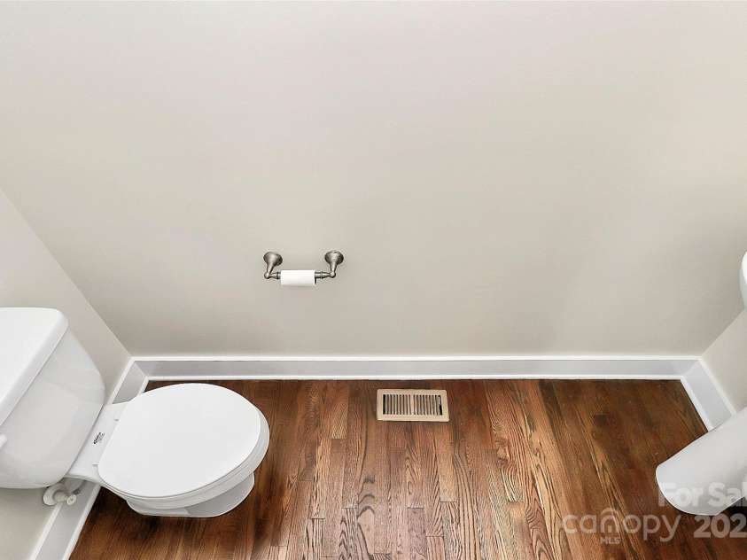 1037 Pierre Drive, Charlotte, NC 28205.  MLS# CAR4229357, YatesRealty ID 14116. Powder Room off the kitchen