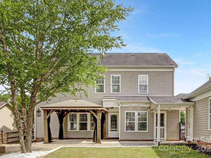 8206 Stourhead Gardens Lane, Waxhaw, NC 28173.  MLS# CAR4250920, YatesRealty ID 14120. Back View of the house