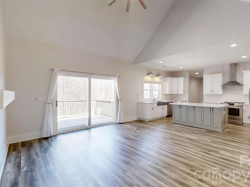 5345 Christopher Road, Iron Station, NC 28080.  MLS# CAR4357522, YatesRealty ID 14122. Spacious living room with electric fireplace
