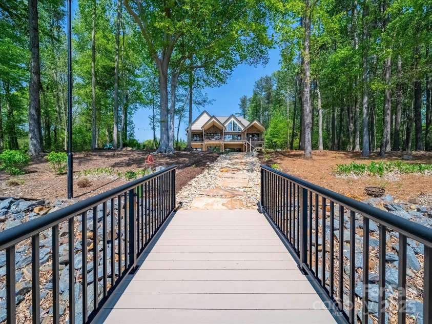 1579 Sunset Pointe Drive, Salisbury, NC 28146.  MLS# CAR4249912, YatesRealty ID 14126. Looking at house from dock