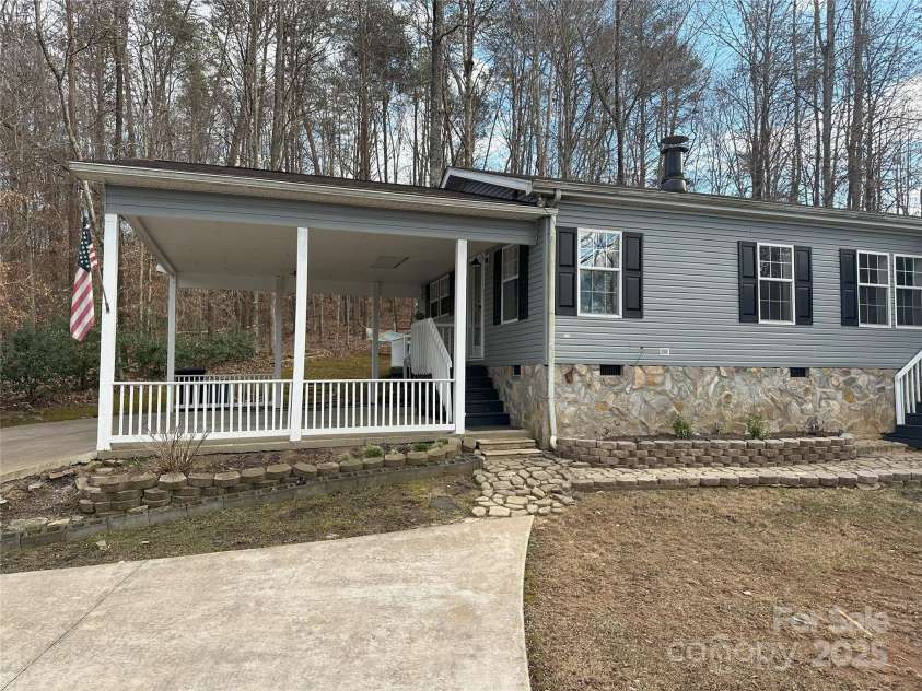 1597 Cleghorn Mill Road, Rutherfordton, NC 28139.  MLS# CAR4213254, YatesRealty ID 1413. Spacious two car carport, paved drive with multiple parking options for easy access. 