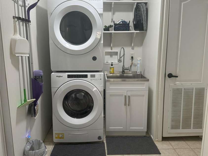 1597 Cleghorn Mill Road, Rutherfordton, NC 28139.  MLS# CAR4213254, YatesRealty ID 1413. Utility area just off the kitchen and back porch entrance.  Washer/Dryer remain. 