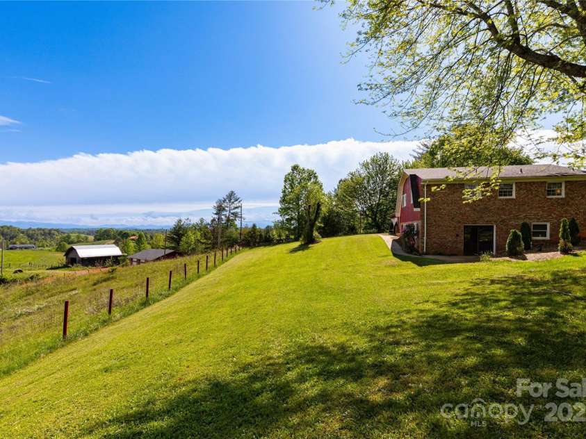 67 Old Turkey Creek Road, Leicester, NC 28748.  MLS# CAR4257740, YatesRealty ID 14147. Side Yard