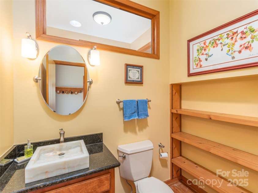 191 Cataloochee Lane, Waynesville, NC 28785.  MLS# CAR4238973, YatesRealty ID 14149. Main level half-bath