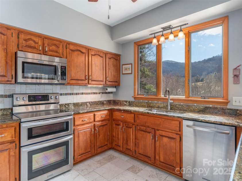 191 Cataloochee Lane, Waynesville, NC 28785.  MLS# CAR4238973, YatesRealty ID 14149. Solid cabinetry, stone counters