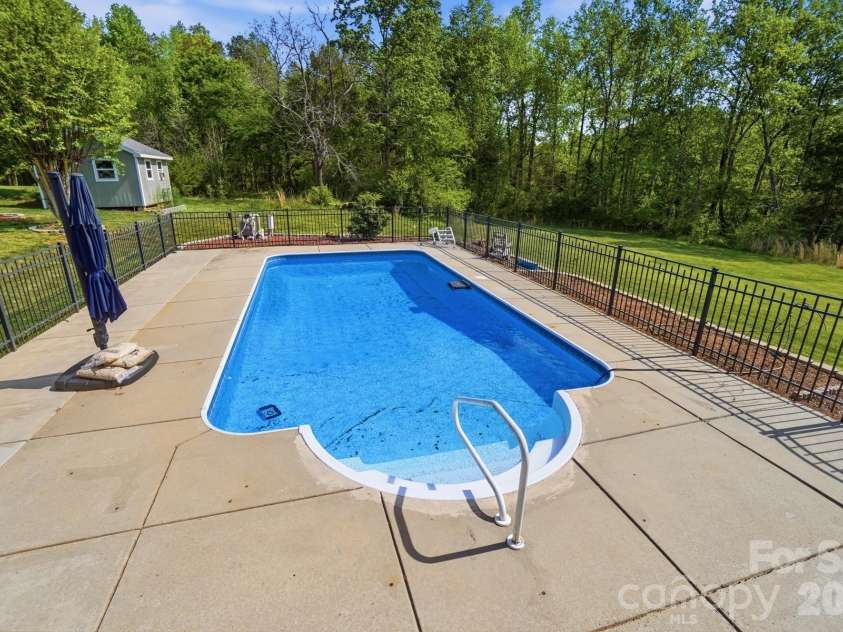 4425 Frank Dellinger Lane, Maiden, NC 28650.  MLS# CAR4368367, YatesRealty ID 14150. Salt water pool