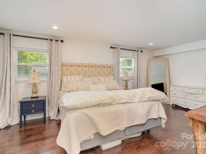 1043 Nancy Drive, Charlotte, NC 28211.  MLS# CAR4247909, YatesRealty ID 14151. Primary Bedroom with Exposed Brick