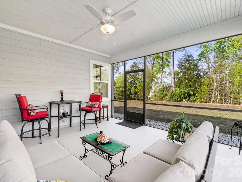 264 Flat Rock Drive, Denver, NC 28037.  MLS# CAR4364100, YatesRealty ID 14151. Enjoy your mornings or evenings on the screened in patio