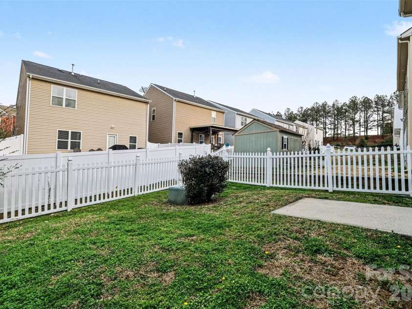 14311 Evening Flight Lane, Charlotte, NC 28262.  MLS# CAR4348964, YatesRealty ID 14156. Fenced in yard