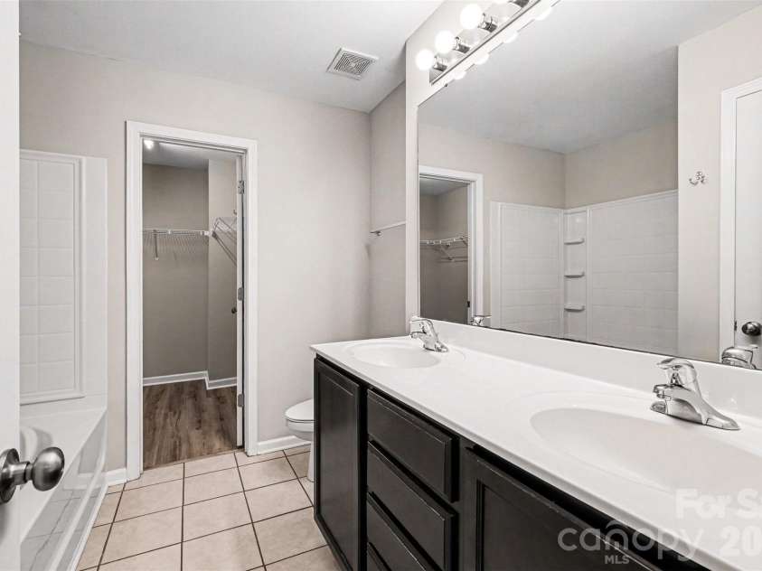 14311 Evening Flight Lane, Charlotte, NC 28262.  MLS# CAR4348964, YatesRealty ID 14156. Primary bathroom