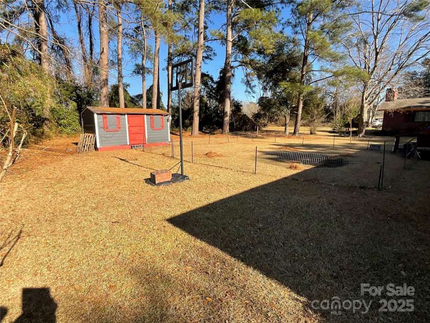 202 Marcellus Street, Laurinburg, NC 28352.  MLS# CAR4248496, YatesRealty ID 14157. Backyard Shed
