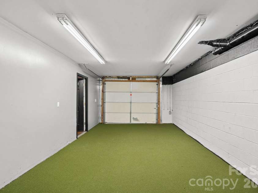 1845 Flowes Store Road, Concord, NC 28025.  MLS# CAR4353597, YatesRealty ID 14164. Basement single car garage converted