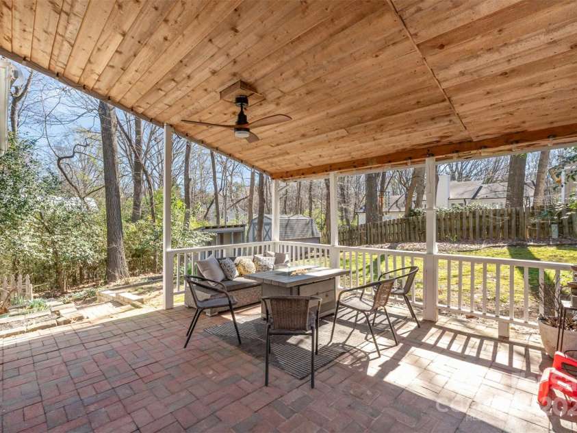 6525 Castlegate Drive, Charlotte, NC 28226.  MLS# CAR4223050, YatesRealty ID 14179. Covered back patio